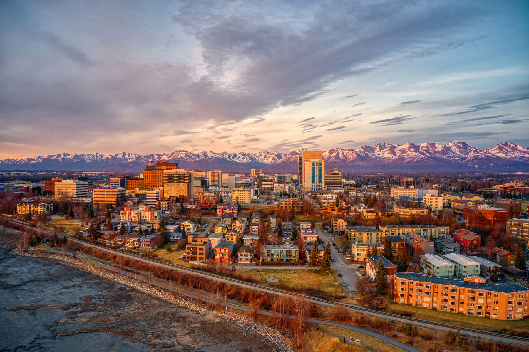 Anchorage, Alaska skyline with mountains at sunset
